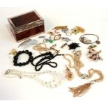 A quantity of costume necklaces and brooches.