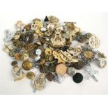 A large quantity of Military badges and buttons.