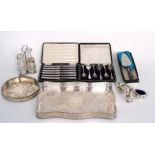 A silver and cut glass cruet set, dated 1912, a cased set of silver teaspoons, Sheffield 1909, a