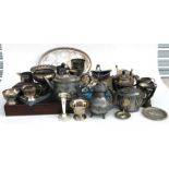 A silver plated tea set, a galleried oval tray, a silver plated trophy, cutlery and other items (