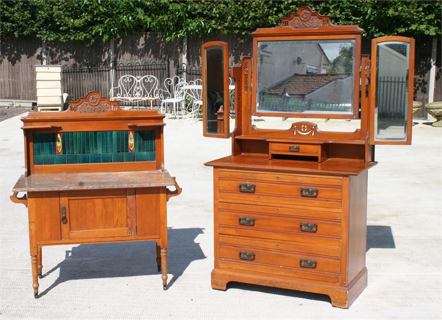 A late 19th century satin walnut triple mirror dressing chest, with three long graduated drawers;