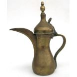 A Turkish / Islamic dallah coffee pot with impressed mark to body, 31cm (12.25ins) high.