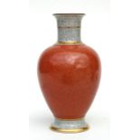 A Royal Copenhagen porcelain vase with orange crackle glaze decoration, 17cm (6.75ins) high.