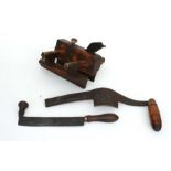 Three vintage woodworking tools.