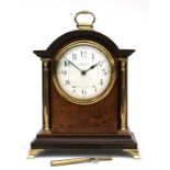 A French mantle clock, the white enamel dial with Arabic numerals, signed 'Thos. Sly & Son