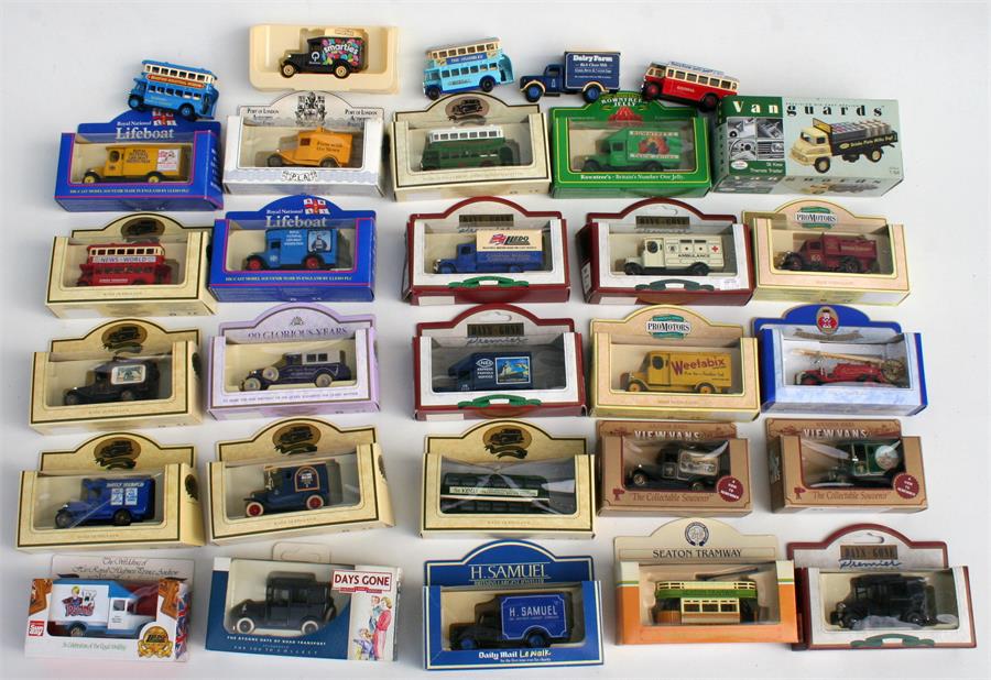 A large quantity of boxed and unboxed Lledo Diecast model cars with five collectors display