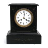 A Victorian black slate mantle clock, the enamel dial with Roman numerals, 25cm (9.75ins) wide.