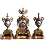 A late 19th century French gilt metal and porcelain mounted clock garniture, the clock with