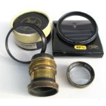 A quantity of assorted vintage camera lenses and filters.