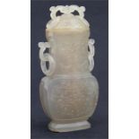 A late 19th / early 20th century Chinese carved grey agate vase and cover with ring loop handles,