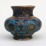 A Chinese cloisonne censer decorated with flowers and stylised dragons on a pale blue ground, and