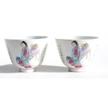 A pair of Chinese porcelain tea bowls, decorated with figures in enamel colours and panels of