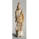 A carved alabaster figure in the form of a Chinese scholar, 51cm (20ins) high.