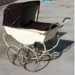 A 1950's Marmet coach built pram and cover.