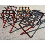 A quantity of folding suitcase stands (7).