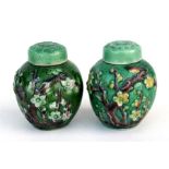A pair of Wang Bing Rong style miniature vases & covers decorated flowers on a green ground, 7cm (
