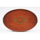 An Edwardian mahogany oval two-handled tray 61cm (24ins) wide.