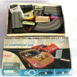 A Minic slot car motor racing game, together with a Tri-ang slot car game (2).