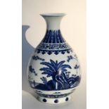 A late 19th / early 20th century blue and white vase, decorated with bamboo and foliage, blue six