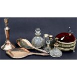 A silver backed hand mirror and brush, a silver mounted scent bottle, a cut glass scent bottle and