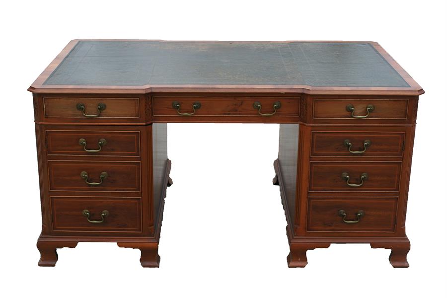 A reproduction yew wood pedestal partners desk, with green leather inset top above a combination