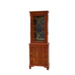 A reproduction yew wood display cabinet, the astragal glazed door enclosing illuminated glass