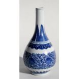 A Chinese blue & white vase decorated with flowers and foliate scrolls, 30cm (12ins) high. Condition