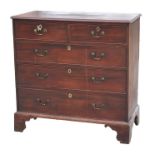 An early 19th century mahogany chest of two short and three long graduated drawers, standing on
