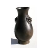 A Chinese Ming Dynasty bronze vase with lion masks, having four character pressed seal mark to the