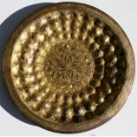 A Persian / Ottoman gilt metal tombak charger, 35cm (13.75ins) diameter.