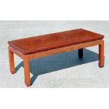 A Chinese hardwood kang or coffee table, standing on square legs, 97cm (38ins) wide.