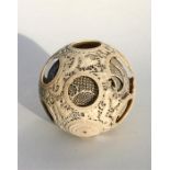 A 19th century Chinese eleven layer reticulated ivory puzzle ball, 11cm (4.25ins) diameter (a/f).