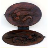 A pair of Chinese hardwood oval relief carved panels depicting fish and crustaceans, 37 by 55cm (