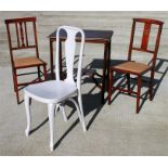 An Edwardian two-tier occasional table; together with two Edwardian bedroom chairs and a bentwood