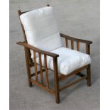 An early 20th century oak easy chair.