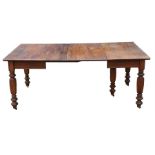 A late 19th century oak extending dining table with three extra leaves, on turned legs, 182 by 106cm