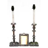 A pair of silver plated candlestick table lamps, 53cm (20.75ins) high; together with a silver