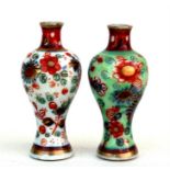 A pair of Chinese Kangxi miniature clobbered vases, 6cm (2.25ins) high.