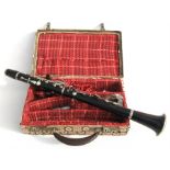 A 5-piece rosewood clarinet and case.