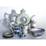 A Chinese crackle glaze teapot, a famille rose vase and cover, two famille rose jugs, and other