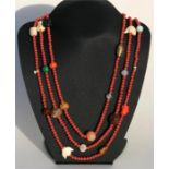 A Japanese Ojime and pink glass bead necklace, 192cm (75.5ins) total length.