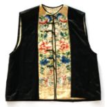 A late 19th / early 20th century Chinese silk waistcoat, embroidered with flowers and decorated