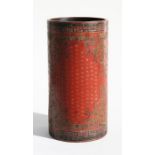 A Chinese lacquer brush pot, profusely decorated with foliate scrolls and calligraphy within panels,