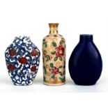 A 19th century Chinese cobalt blue snuff bottle and two other snuff bottles (3).