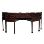A George II mahogany demi lune sideboard, the central long drawer flanked by a pair of deep