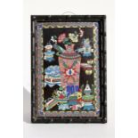 A Chinese cloisonne panel, decorated with vases and flowers on a black ground, mounted in a carved