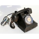 A black GPO Bakelite telephone, model number 312L FWR65/3A.
