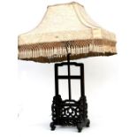 A Chinese carved hardwood table lamp and shade, 74cm (29ins) high.