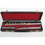 A cased John Grey silver plated flute.