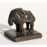 An 18th / 19th century Chinese bronze seal in the form of an elephant, with six character mark to